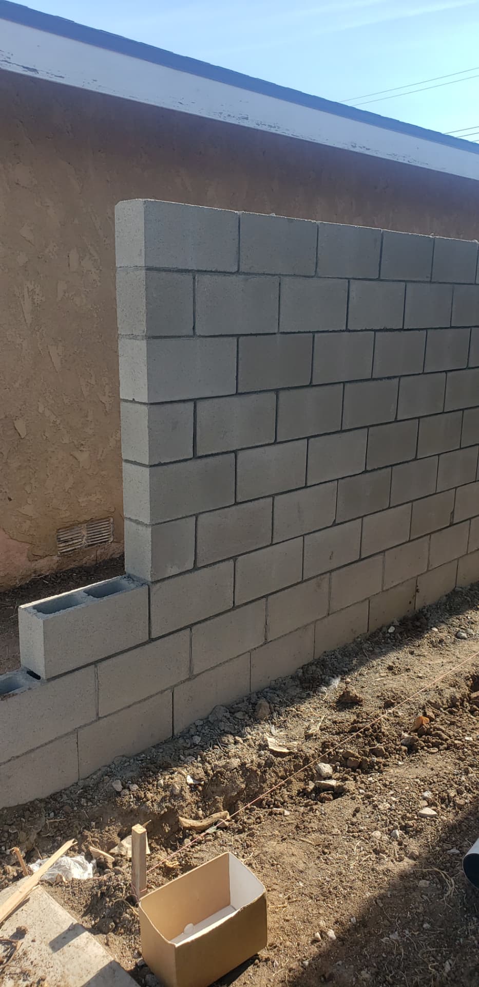 Newly built block wall ready for the next stage of an outdoor remodel